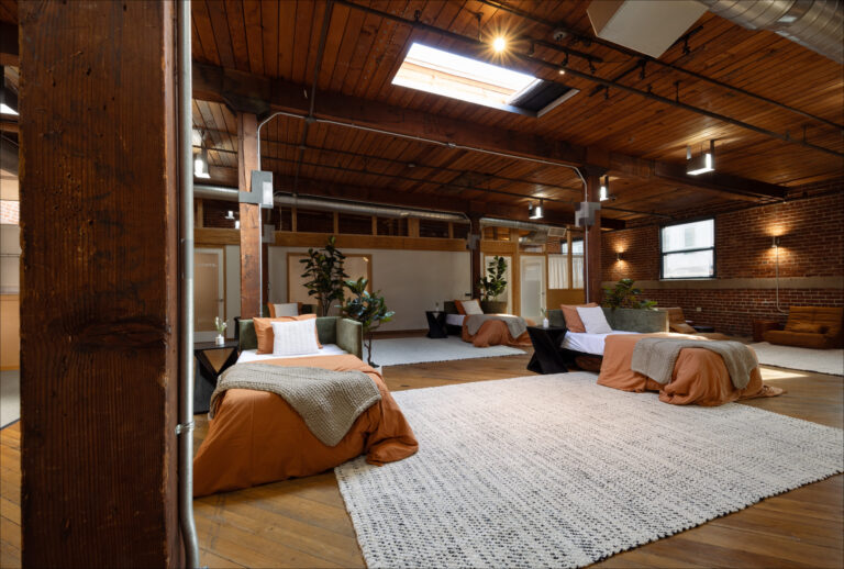 a psilocybin therapy center with wood floors beds